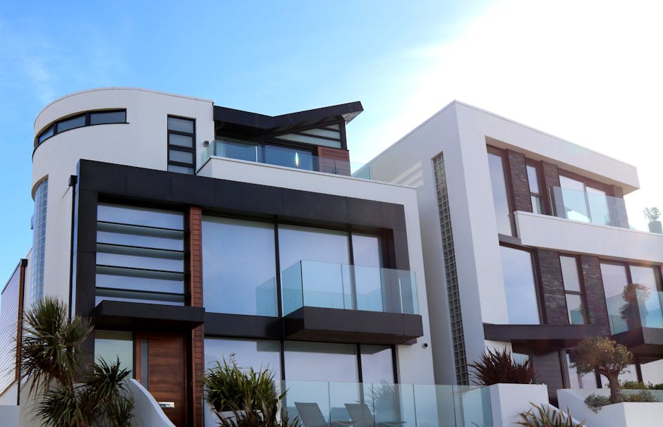 Contemporary luxury home with glass balconies in Poole, UK, showcasing modern architectural design
